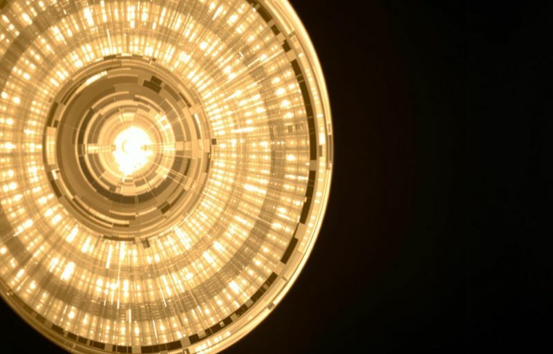 Luminaire emitting light, showing energy flow.